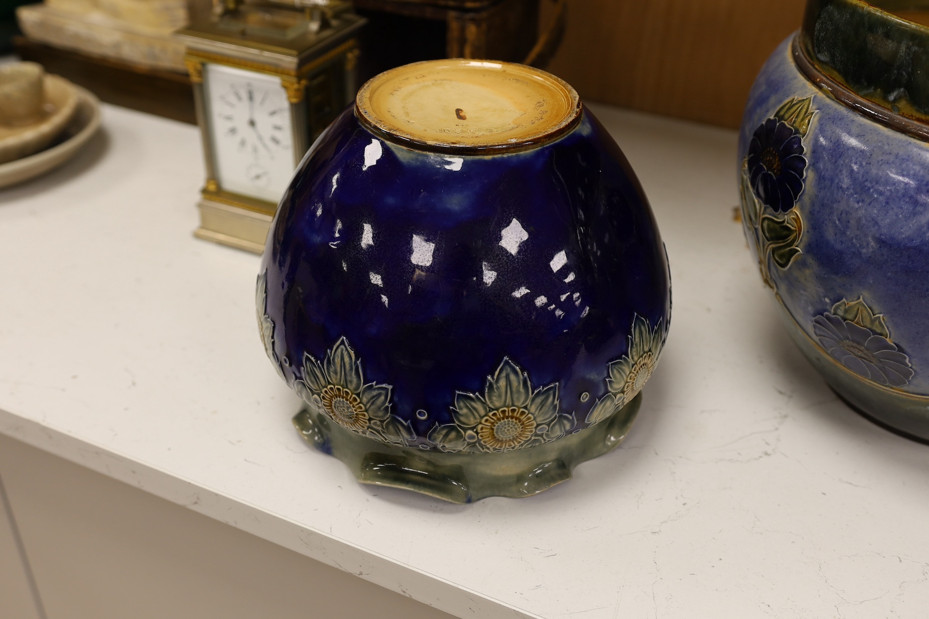 A Royal Doulton blue stoneware jardiniere by Hannah Barlow and another smaller jardiniere by Maude Bowden, largest 29cm in diameter (2). Condition - good